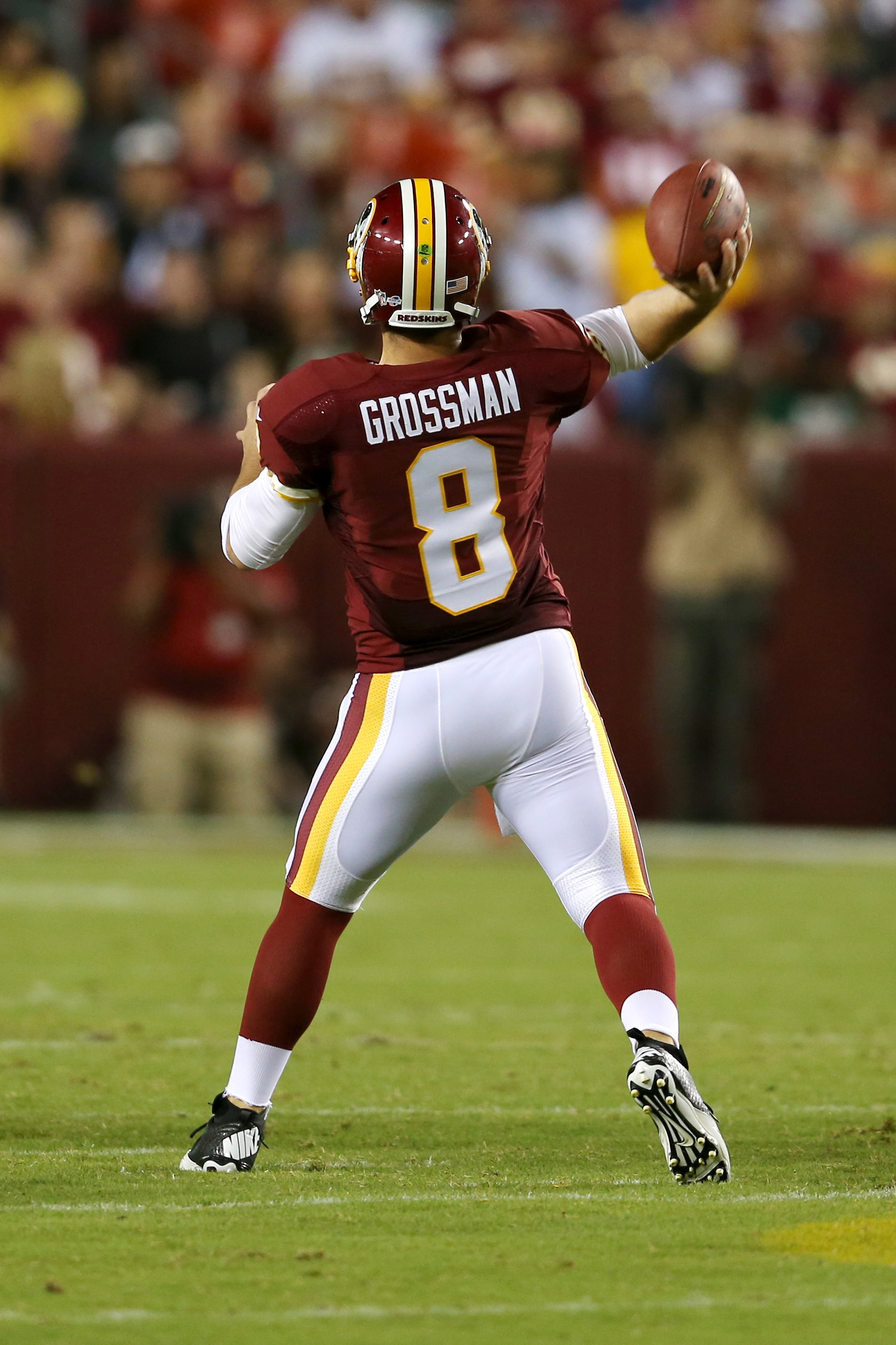 Chicago Bears quarterback Rex Grossman sets to pass during his