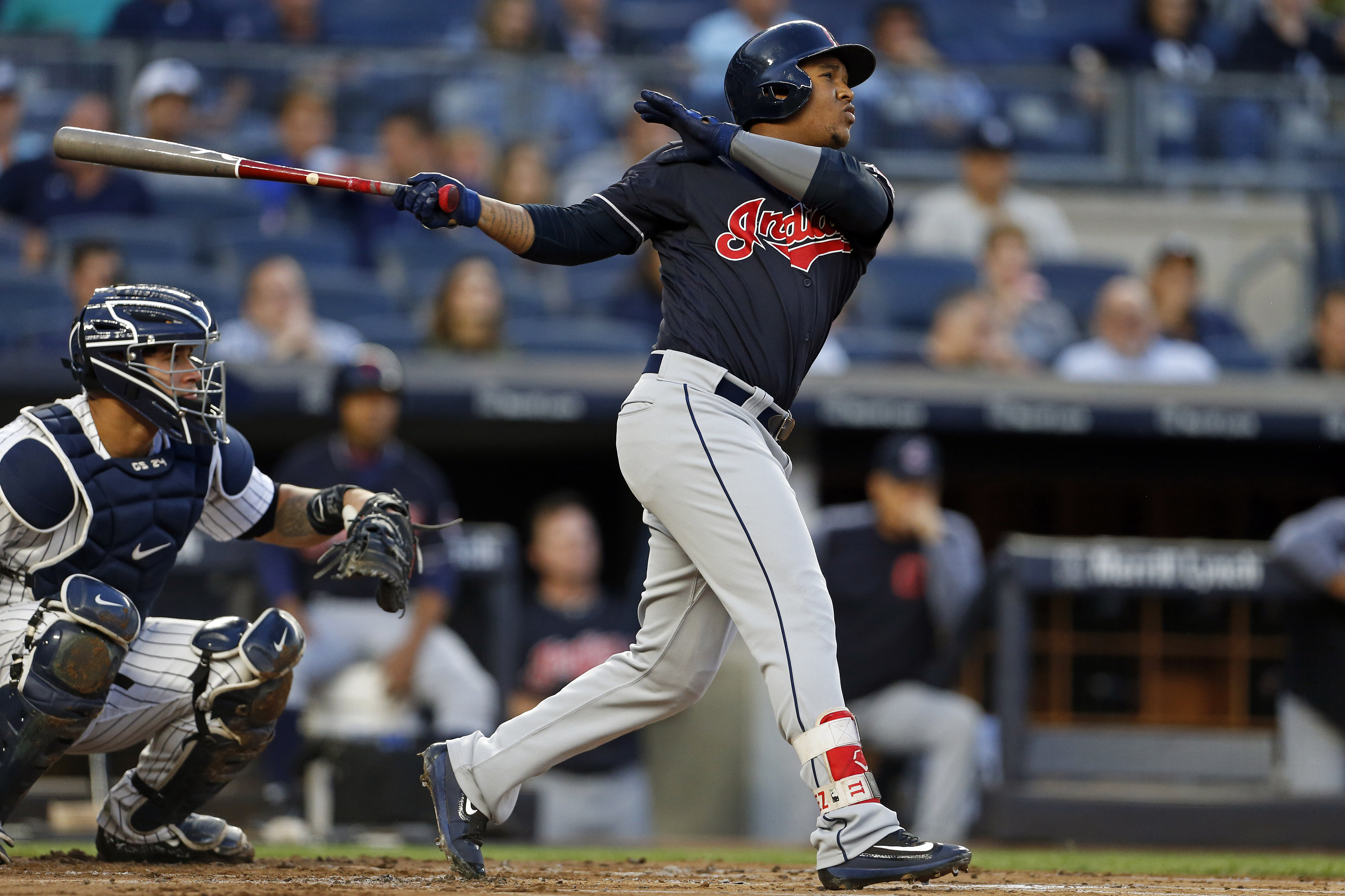 New York Yankees' Jacoby Ellsbury hits an RBI-single off Cleveland