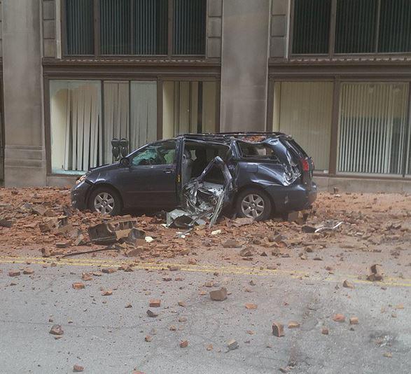 Downtown building facade crumbles, crushes van below | wkyc.com